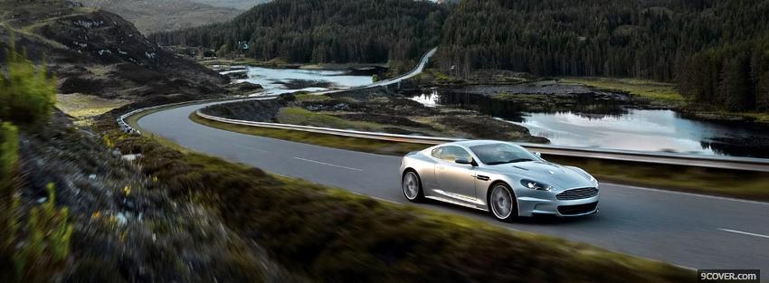 Photo aston martin on the road Facebook Cover for Free